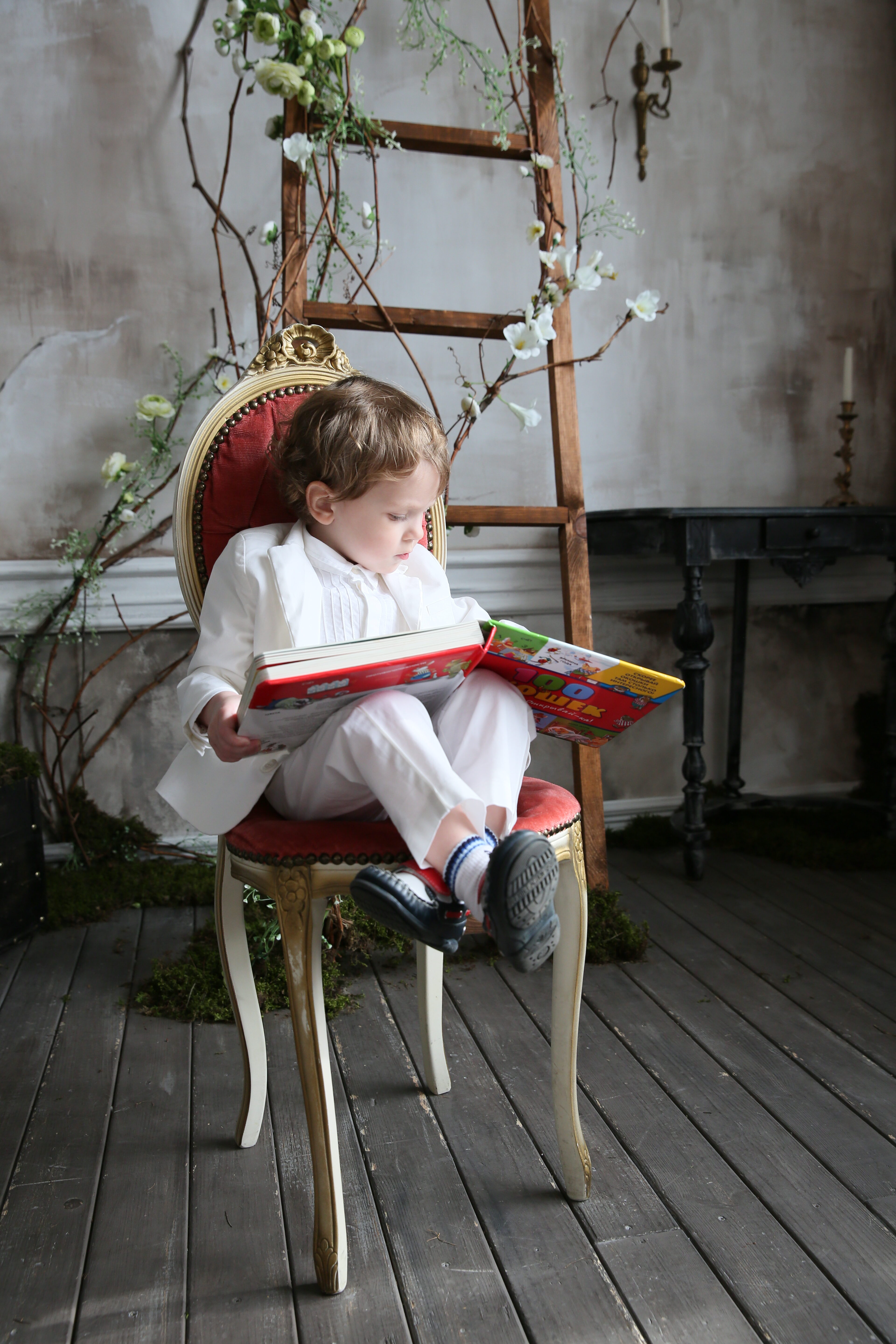 3 years boy reading a book