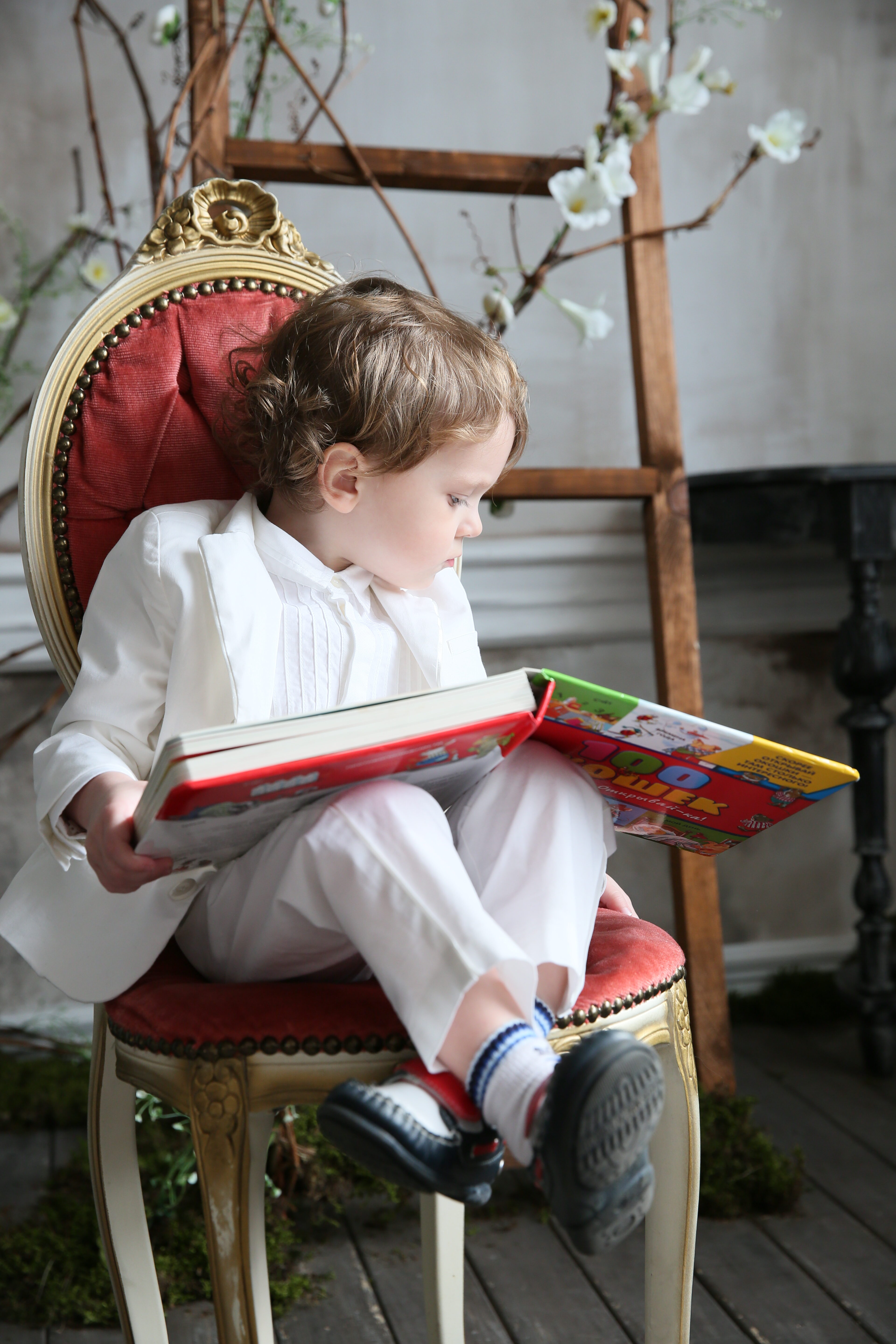 3 years-old Boy reading the book